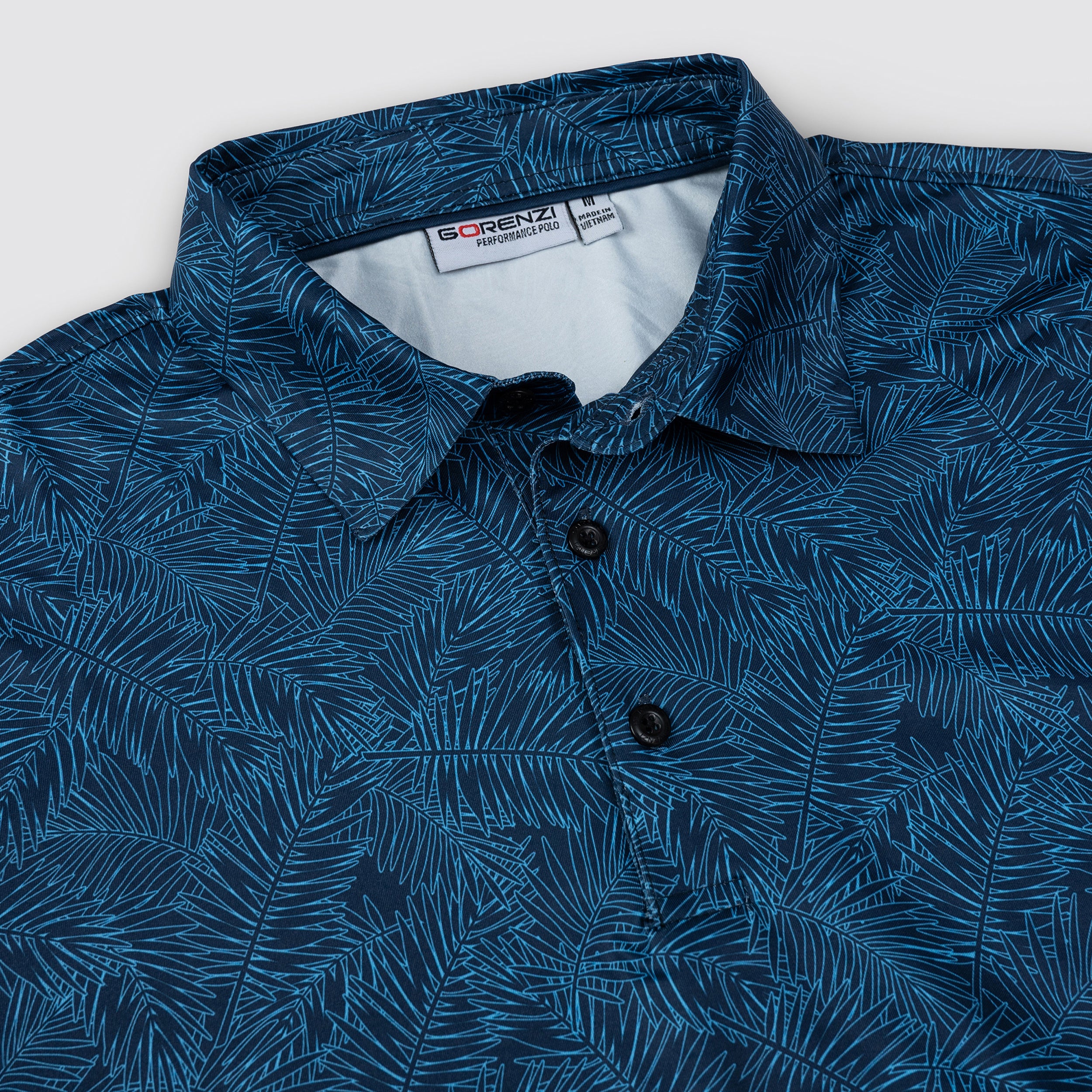 Deep Blue Tropical Leaf Men’s Performance Golf Polo