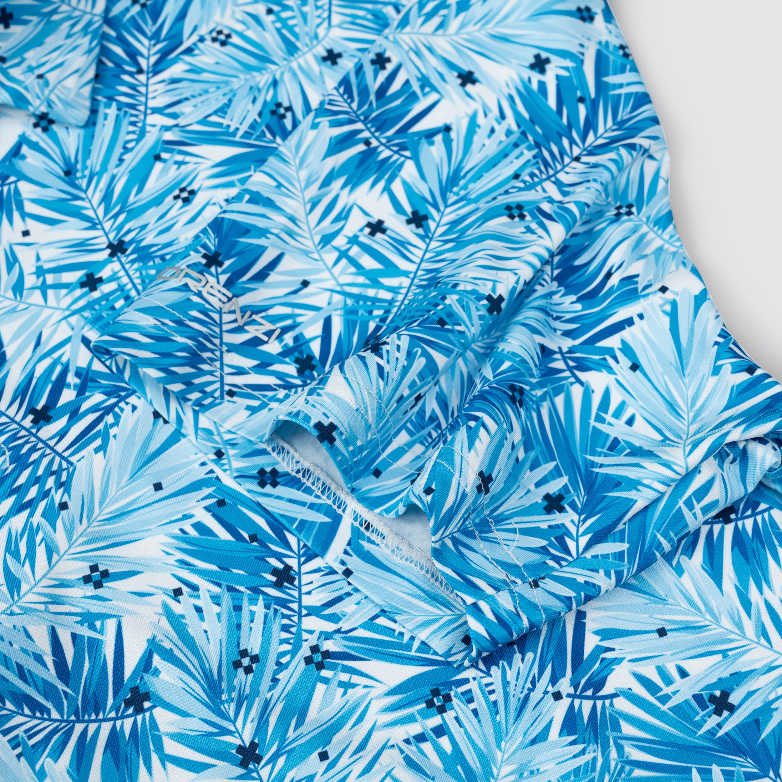 Sky Blue Tropical Leaf Men’s Performance Golf Polo